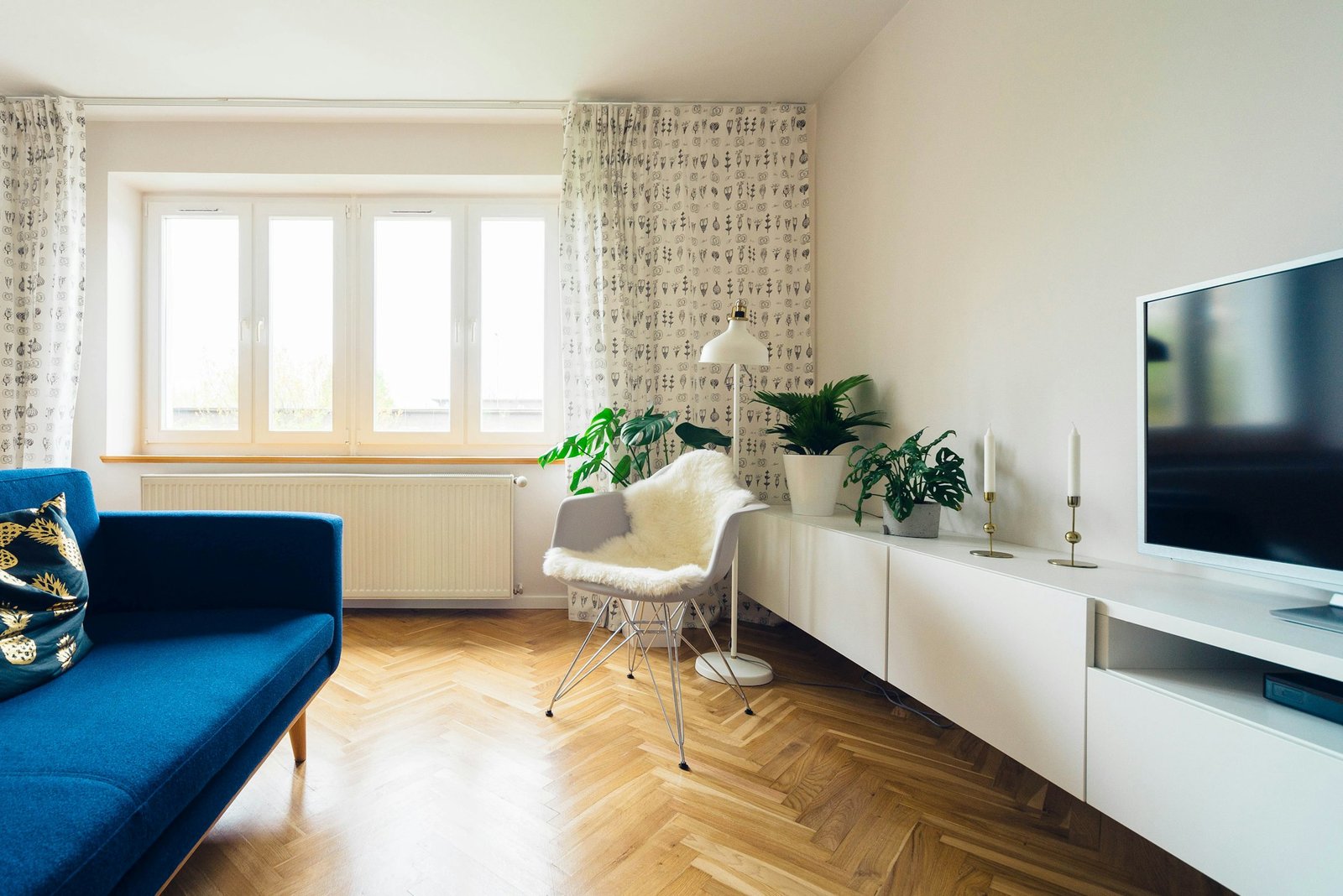 Bright modern residential living room with parquet floor